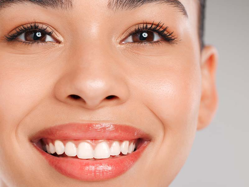 Person smiling for a cosmetic dentistry guide