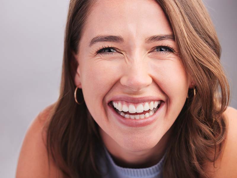 Person smiling for a cosmetic dentistry guide