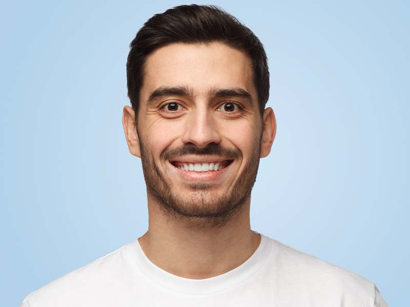 Person smiling for a dental X-ray guide