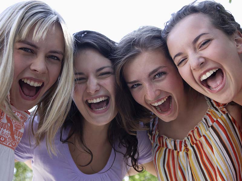 Patients smiling for a dental imaging guide