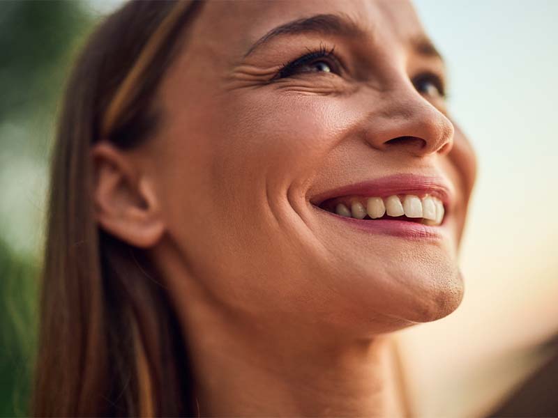 Woman smiling outdoors